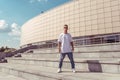 Young stylish man posing, guy dancer, summer city, dancing break dance, healthy fitness athlete life style, white t Royalty Free Stock Photo