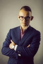 Young stylish man in suit and glasses