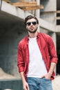 young stylish man in sunglasses at construction Royalty Free Stock Photo