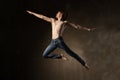 Young and stylish modern dancer on grey background Royalty Free Stock Photo