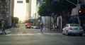 Young woman crossing street following traffic rules. Asian girl walking road Royalty Free Stock Photo