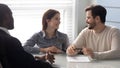 Young successful couple, man and woman discuss terms of contract. Royalty Free Stock Photo