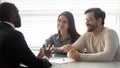 Young successful couple, man and woman listening diverse manager. Royalty Free Stock Photo