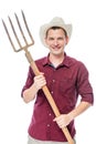 Young Successful Farmer In A Red Shirt With Pitchforks