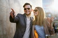 Young successful happy couple having fun in the city together. People date travel business concept. Royalty Free Stock Photo