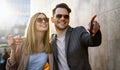 Young successful happy couple having fun in the city together. People date travel business concept. Royalty Free Stock Photo