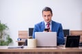 Young successful male employee working in the office Royalty Free Stock Photo