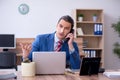 Young successful male employee working in the office Royalty Free Stock Photo