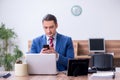 Young successful male employee working in the office Royalty Free Stock Photo