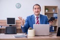 Young successful male employee working in the office Royalty Free Stock Photo