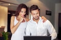 Young successful manager couple at home with laptop Royalty Free Stock Photo