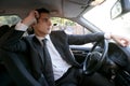 Young suit businessman inside his car