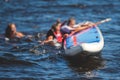 Group of young sup surfers fall from SUP stand up paddle board, women drowning, concept of fail solving problems, team work and Royalty Free Stock Photo