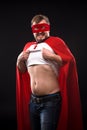 Young super hero man in studio Royalty Free Stock Photo