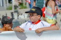 Young supporter looks tense at the World Orienteering Championships in Lausanne, Switzerland