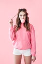 Young suprised woman blowing bubble from chewing gum Royalty Free Stock Photo