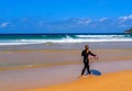 Young female surfer at the beach