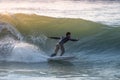 Young surfer enjoying waves Royalty Free Stock Photo