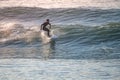 Young surfer enjoying waves Royalty Free Stock Photo