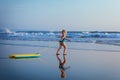 Young surfer girl with bodyboard has fun on sea beach Royalty Free Stock Photo