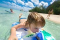 Young surfer, happy young boy in the ocean on surfboard. Royalty Free Stock Photo