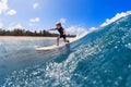 Young surfer learn to ride on surfboard on sea waves Royalty Free Stock Photo