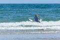 Surfer on the ocean side of Cap Ferret, in France