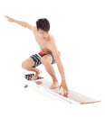 Young surfer practice surfing pose Royalty Free Stock Photo