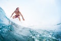 Young surfer rides an ocean tropical wave Royalty Free Stock Photo