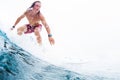 Young surfer rides ocean wave Royalty Free Stock Photo