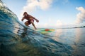 Young surfer rides ocean wave Royalty Free Stock Photo