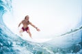 Young surfer rides the perfect tropical ocean wave Royalty Free Stock Photo