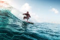 Young surfer rides the wave