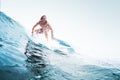 Young surfer rides the wave Royalty Free Stock Photo