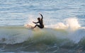 Young surfer riding perfect surf wave