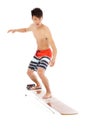 Young surfer simulate surfing pose Royalty Free Stock Photo