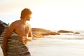 Young surfer standing by sunset Royalty Free Stock Photo