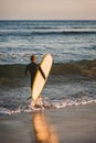 Young surfer about to catch some waves Royalty Free Stock Photo