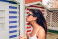 Young surfer woman with top and bikini kissing surfboard Royalty Free Stock Photo