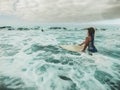 Young surfers having fun inside ocean riding boards - Young people doing surf during vacation with big waves - Travel, youth and Royalty Free Stock Photo