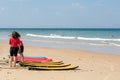 Cap Ferret, Arcachon Bay, France. Young surfers on the beach on the ocean side