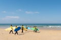 Cap Ferret, Arcachon Bay, France. Young surfers on the beach on the ocean side