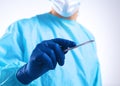 Young surgeon holding a scalpel. Ready for operation Royalty Free Stock Photo