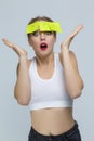 Young Surprised Caucasian Female in White Bra With Yellow Sticky Notes Attached To Her Forehead Against White Background Royalty Free Stock Photo