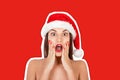 Young surprised girl with open mouth woman in Santa hat and swimsuit. Magazine collage style with trendy color background. Happy Royalty Free Stock Photo