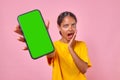 Young surprised Indian woman teenager with phone in hand opens mouth Royalty Free Stock Photo