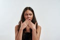 Young surprised worried asian woman covering her mouth with two hands Royalty Free Stock Photo