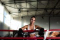 Young sweaty boxer woman or girl in the boxing ring future champion exercise box drills with boxing gloves on her hands. Sporty Royalty Free Stock Photo