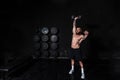 Young sweaty strong fit muscular man with big muscles doing push ups on the dumbbells in the gym hardcore cross workout training Royalty Free Stock Photo