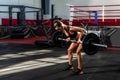 Young sweaty strong muscular bodybuilder woman weightlifting workout training in the gym for back muscles. Royalty Free Stock Photo